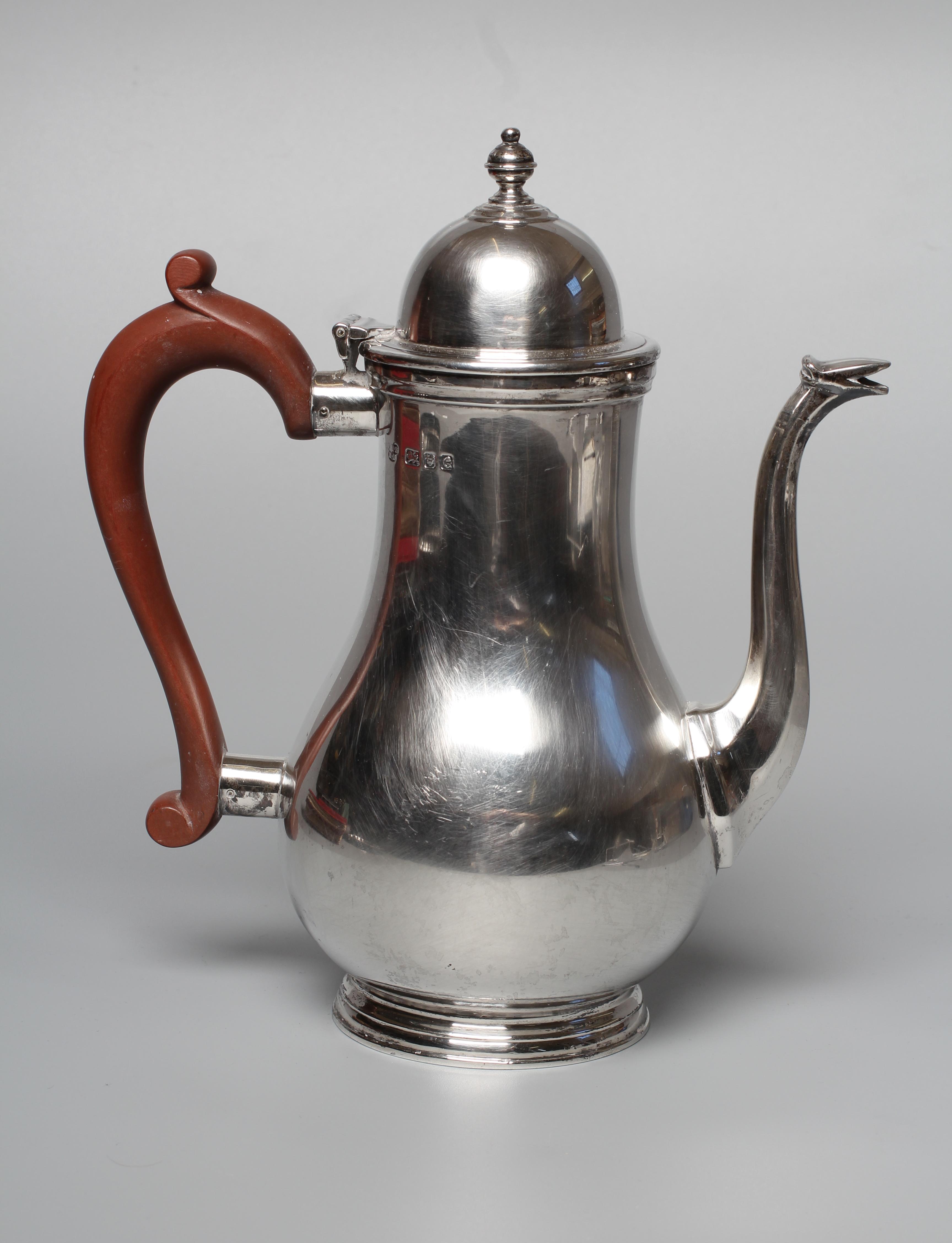 A GEORGE VI HOT WATER JUG by Z Barraclough & Sons, London 1942, of baluster form with hinged high Image