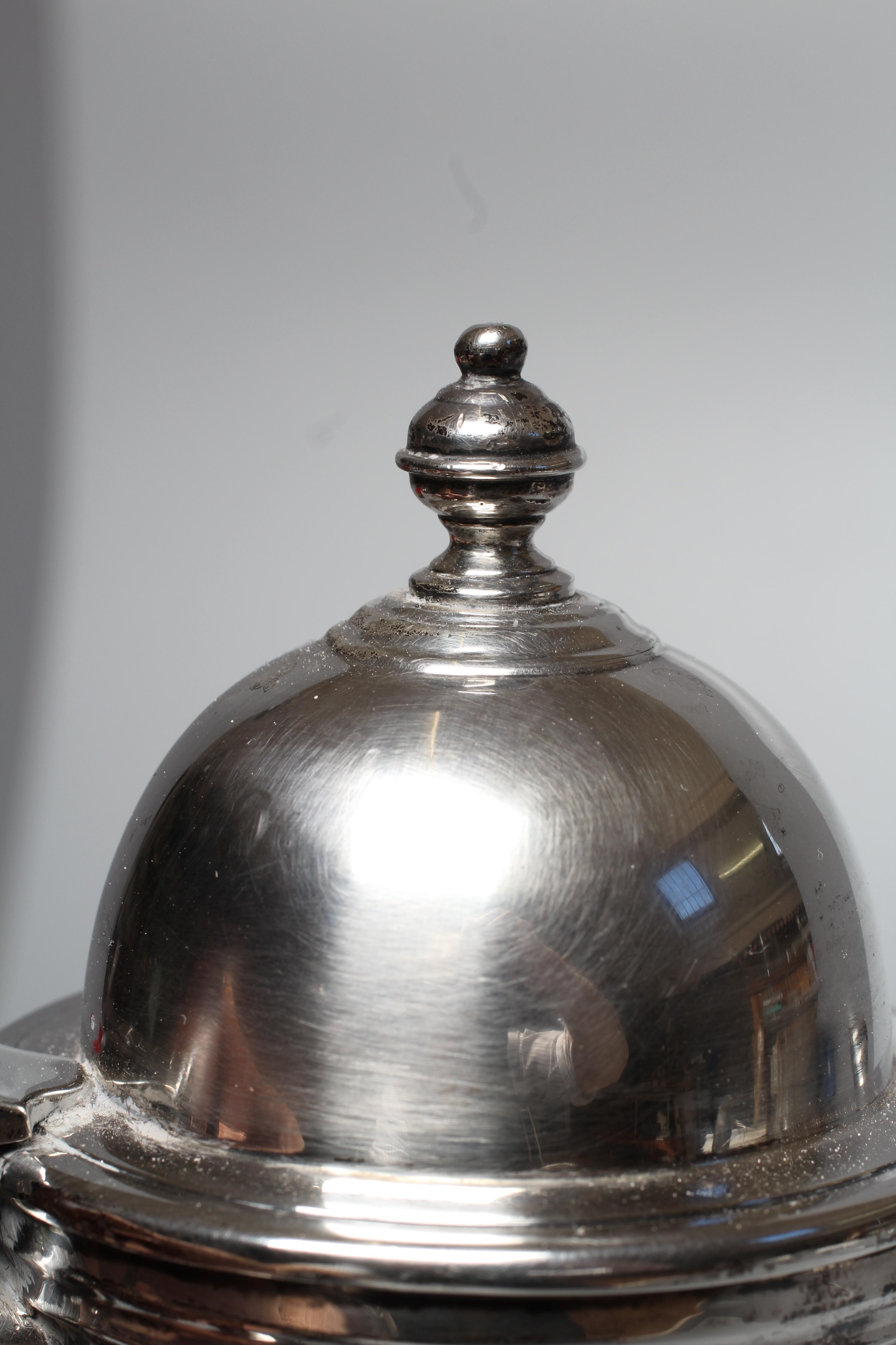 A GEORGE VI HOT WATER JUG by Z Barraclough & Sons, London 1942, of baluster form with hinged high Image