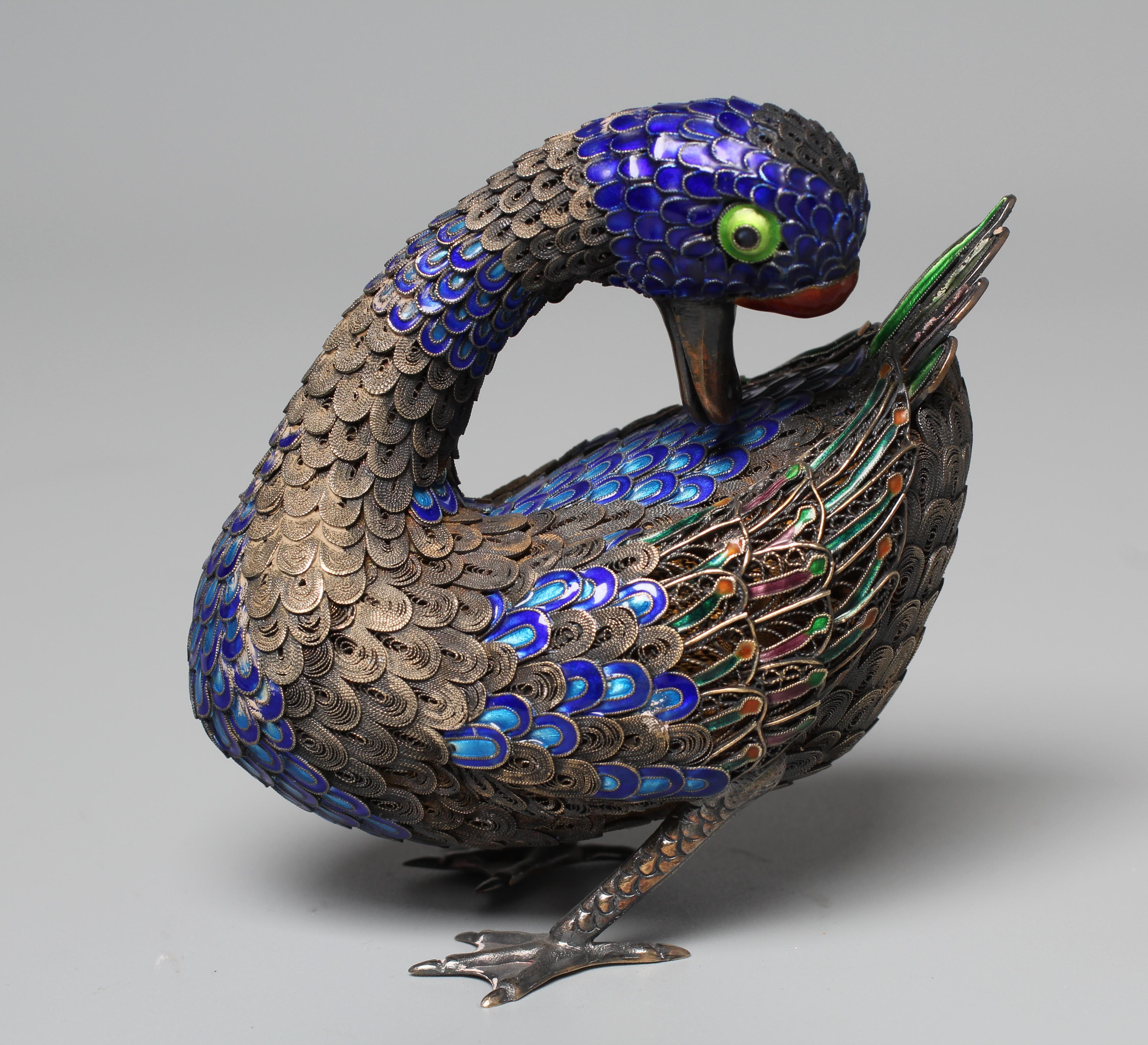 A CHINESE SILVER GILT FILIGREE AND CLOISONNE ENAMEL PREENING DUCK, both feet stamped SILVER, 3 1/22 Image