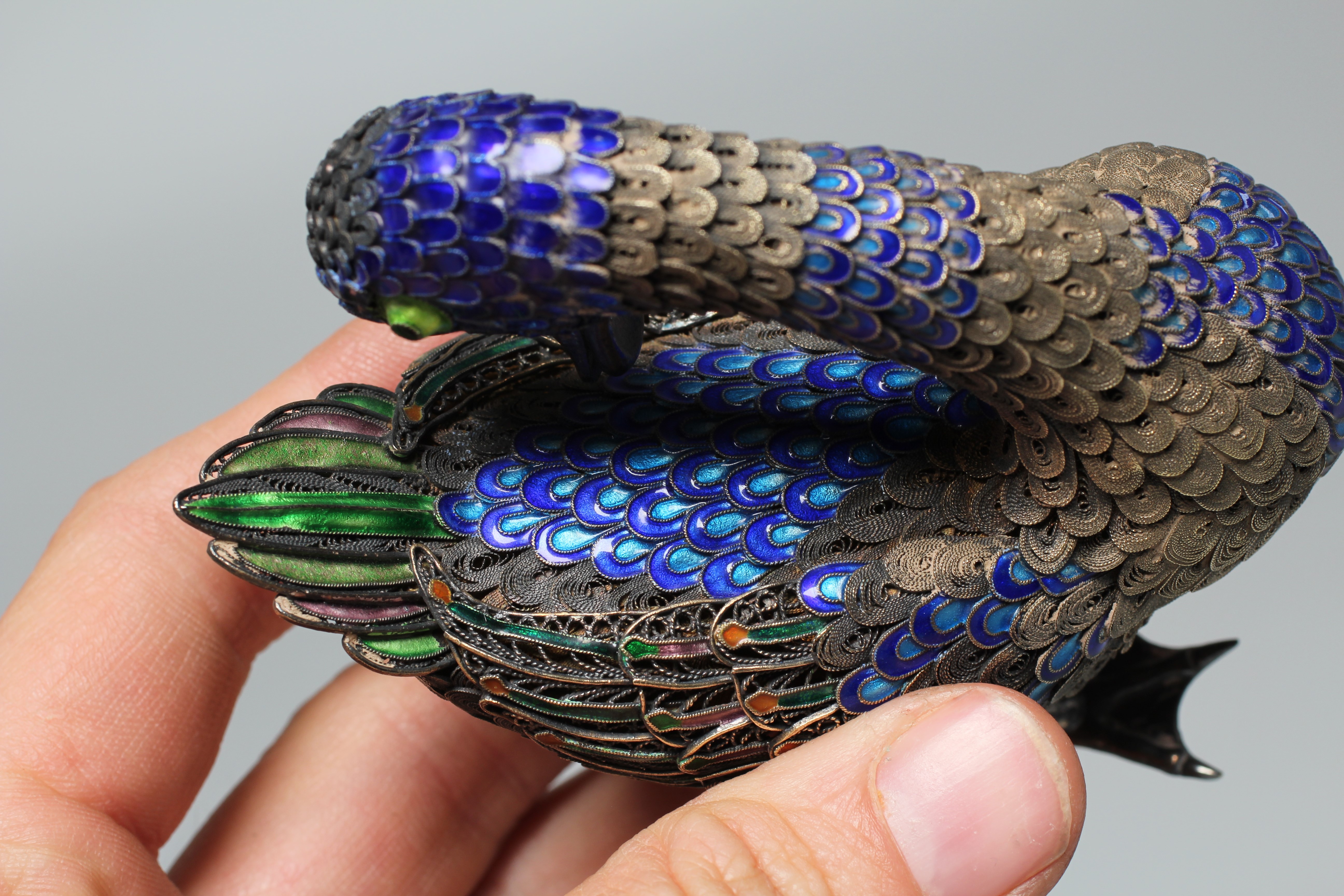 A CHINESE SILVER GILT FILIGREE AND CLOISONNE ENAMEL PREENING DUCK, both feet stamped SILVER, 3 1/22 Image