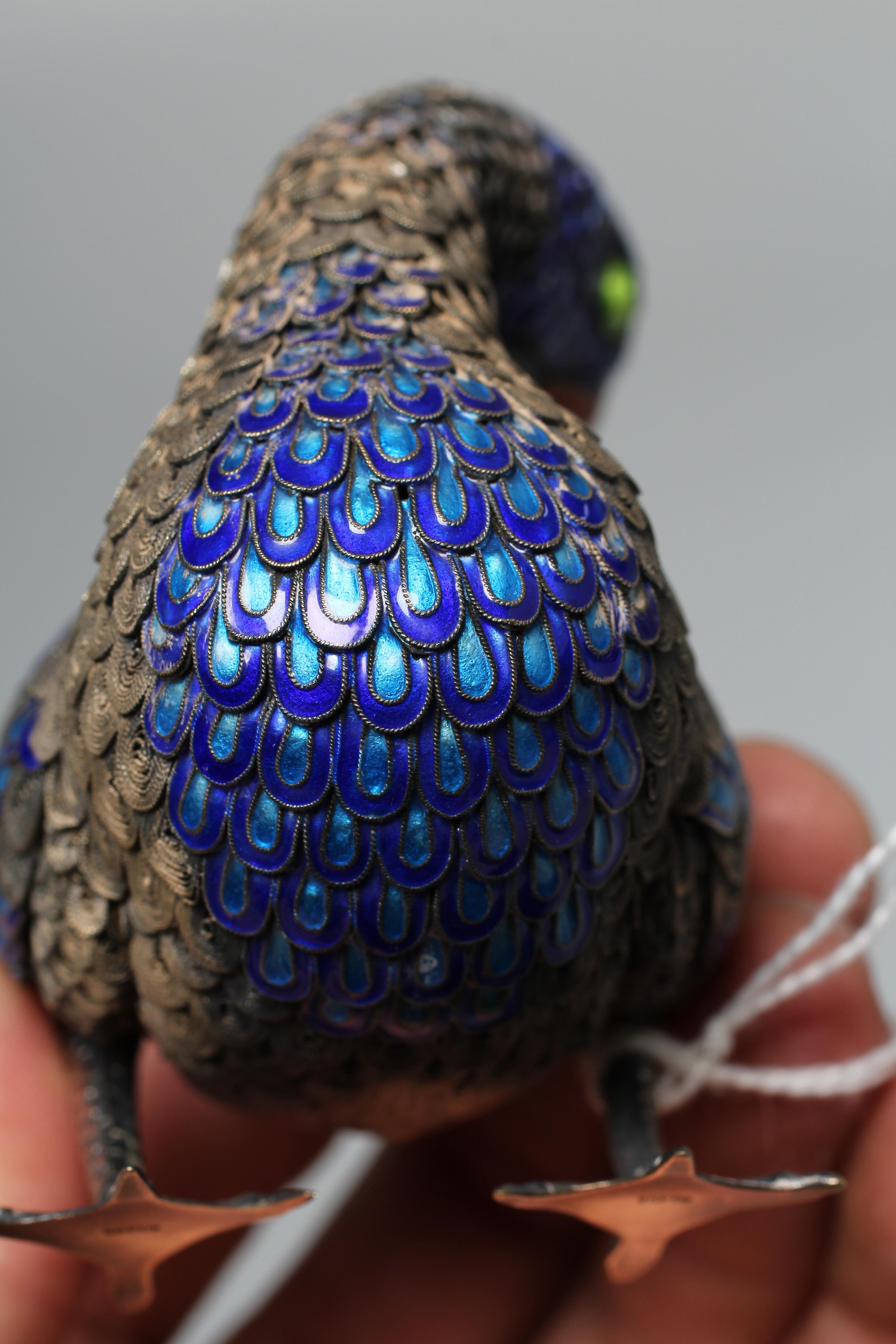 A CHINESE SILVER GILT FILIGREE AND CLOISONNE ENAMEL PREENING DUCK, both feet stamped SILVER, 3 1/22 Image
