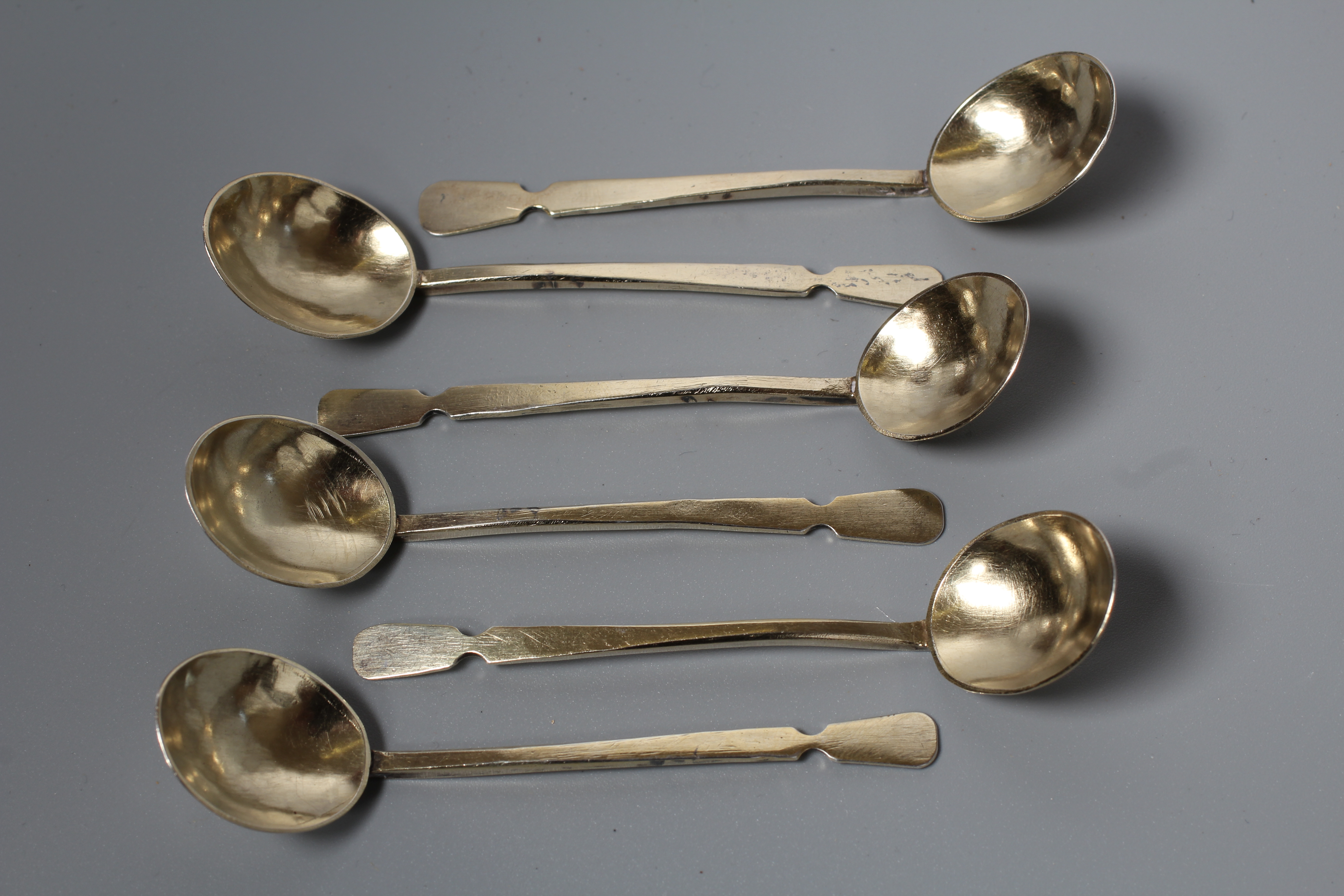 AN UNUSUAL SET OF SIX SCOTTISH SILVER GILT COFFEE SPOONS by Mabel Cambage (art student at Edinburgh) Image