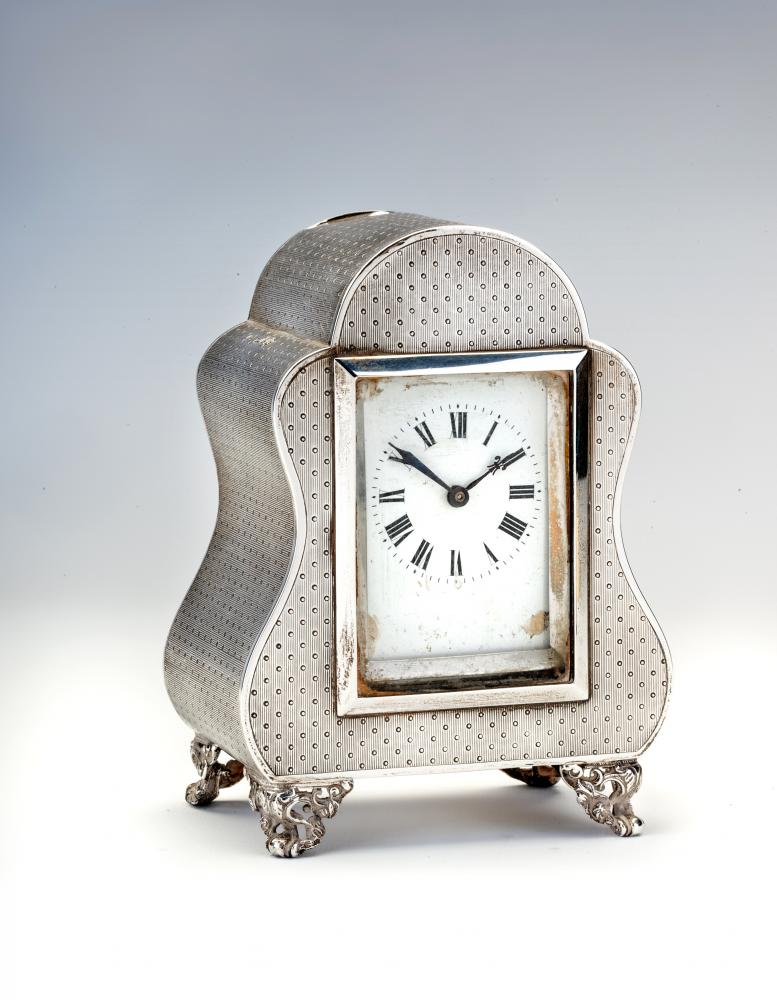 A LATE VICTORIAN SILVER MANTEL TIMEPIECE Image