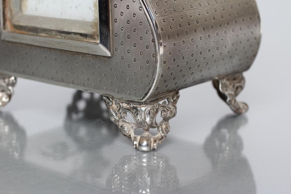 A LATE VICTORIAN SILVER MANTEL TIMEPIECE Image