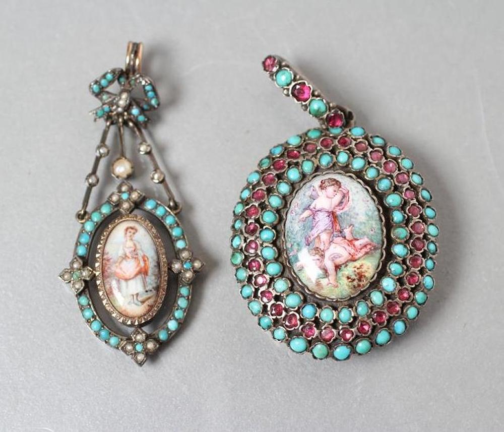 A VICTORIAN PENDANT LOCKET centrally set with an oval enamel plaque painted with two cupids fighting Image