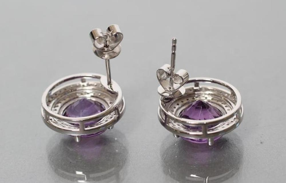 A PAIR OF AMETHYST AND DIAMOND STUD EARRINGS Image