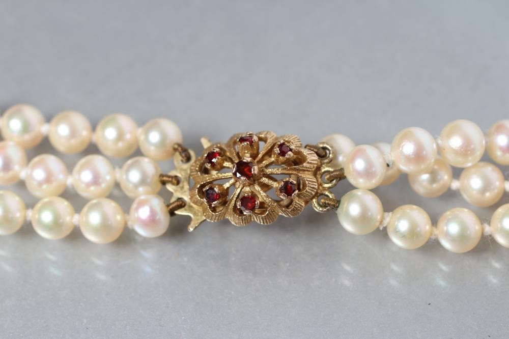 A CULTURED PEARL TRIPLE STRAND NECKLACE Image