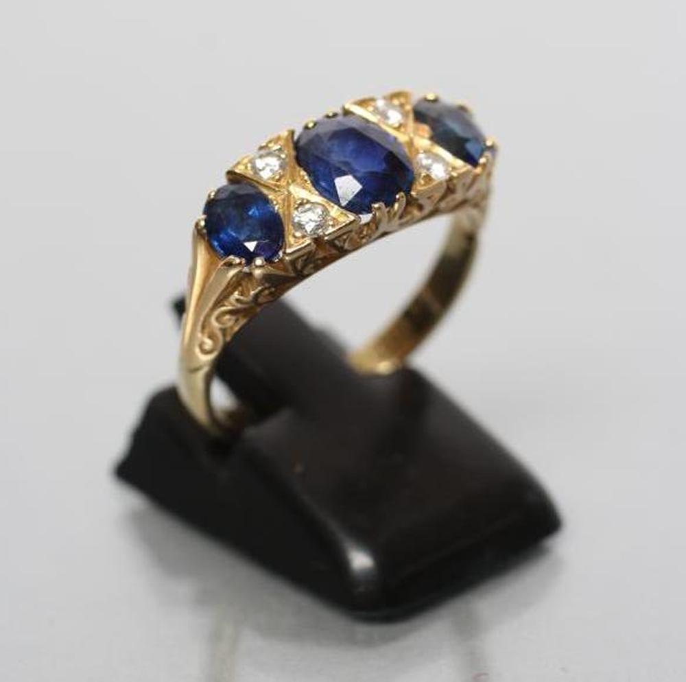 A SAPPHIRE HALF HOOP RING Image