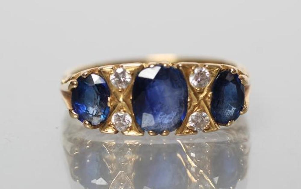 A SAPPHIRE HALF HOOP RING Image