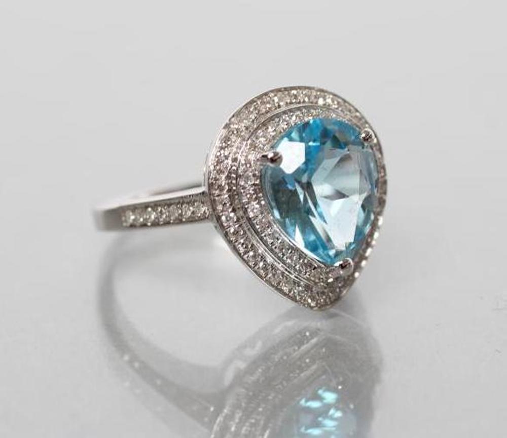 A TOPAZ AND DIAMOND COCKTAIL RING Image