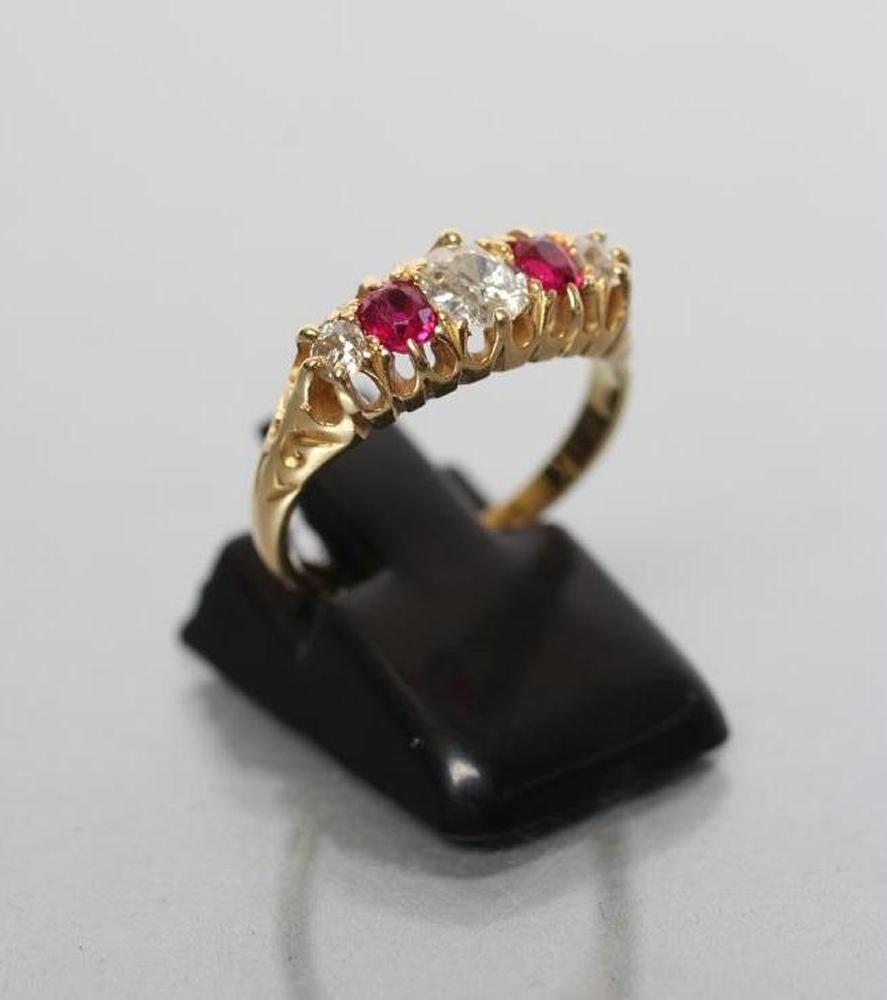 AN EDWARDIAN FIVE STONE RUBY AND DIAMOND RING Image