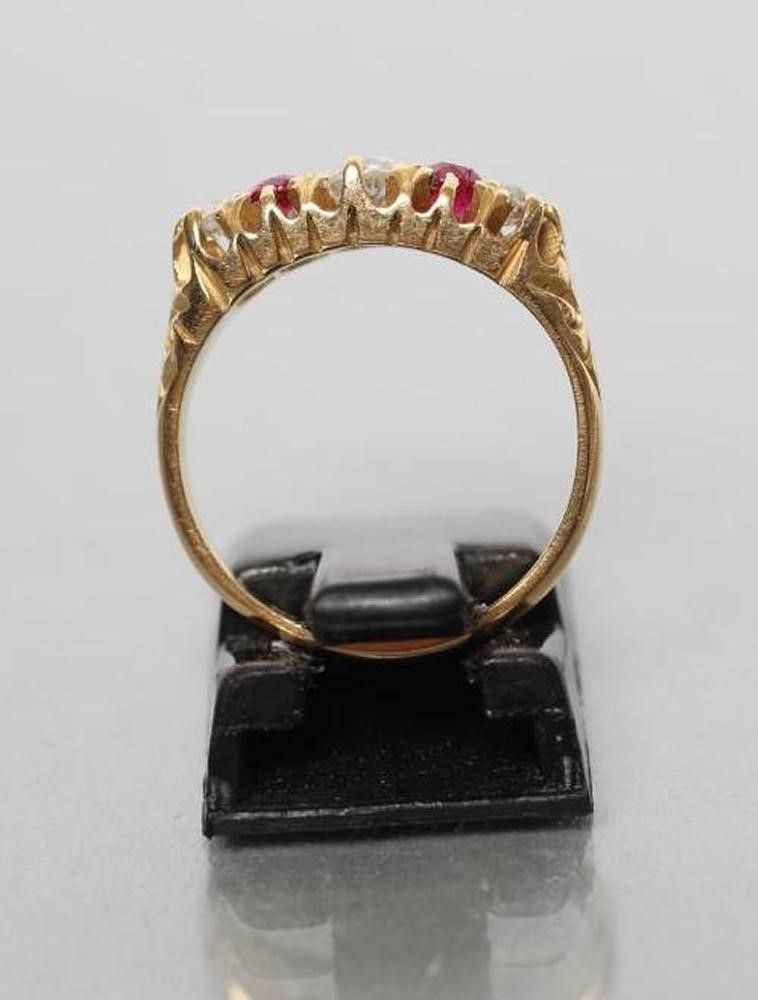 AN EDWARDIAN FIVE STONE RUBY AND DIAMOND RING Image