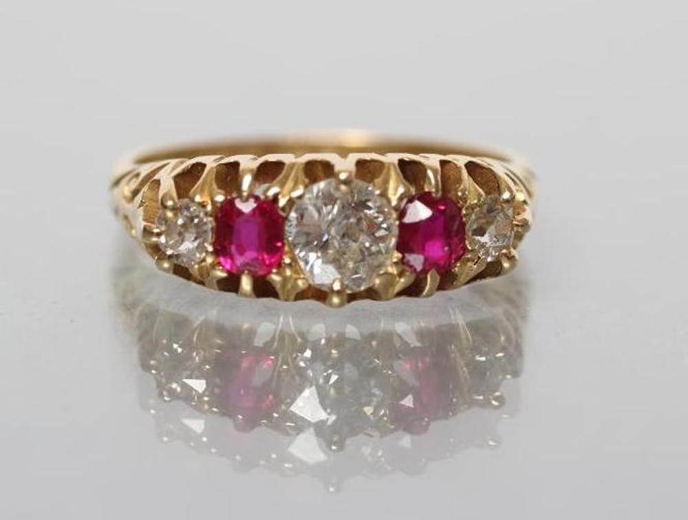 AN EDWARDIAN FIVE STONE RUBY AND DIAMOND RING Image