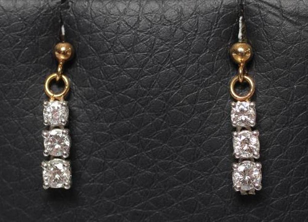 A PAIR OF DIAMOND DROP EARRINGS Image