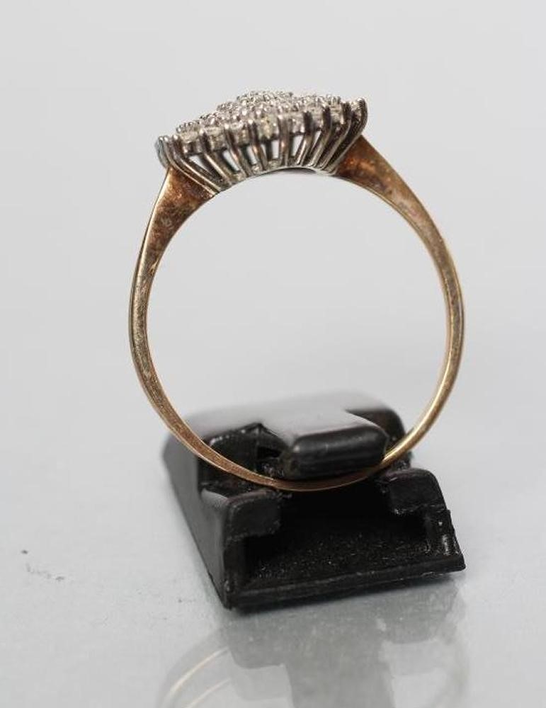 A DIAMOND CLUSTER RING Image