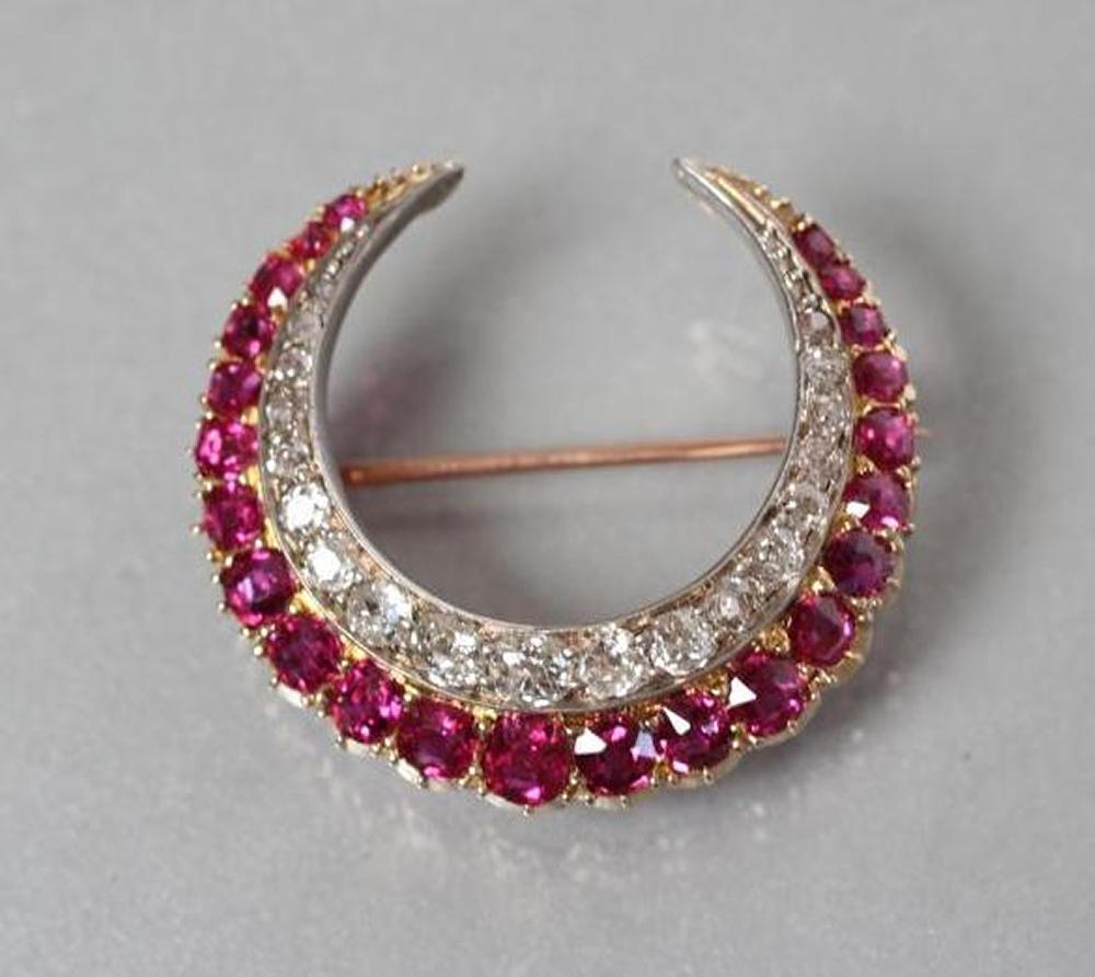 A RUBY AND DIAMOND CRESCENT BROOCH Image