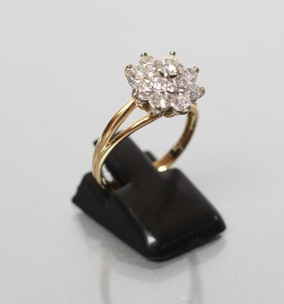 A DIAMOND CLUSTER RING Image