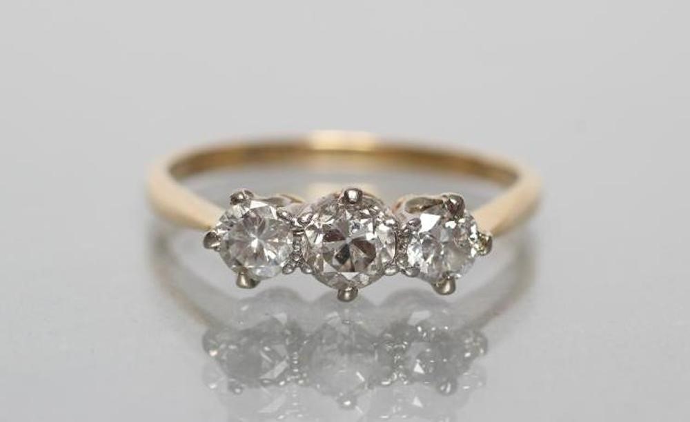A THREE STONE DIAMOND RING Image