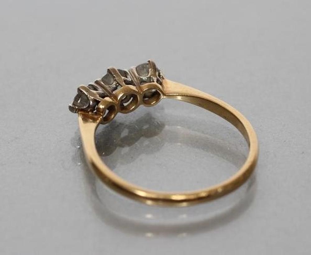 A THREE STONE DIAMOND RING Image