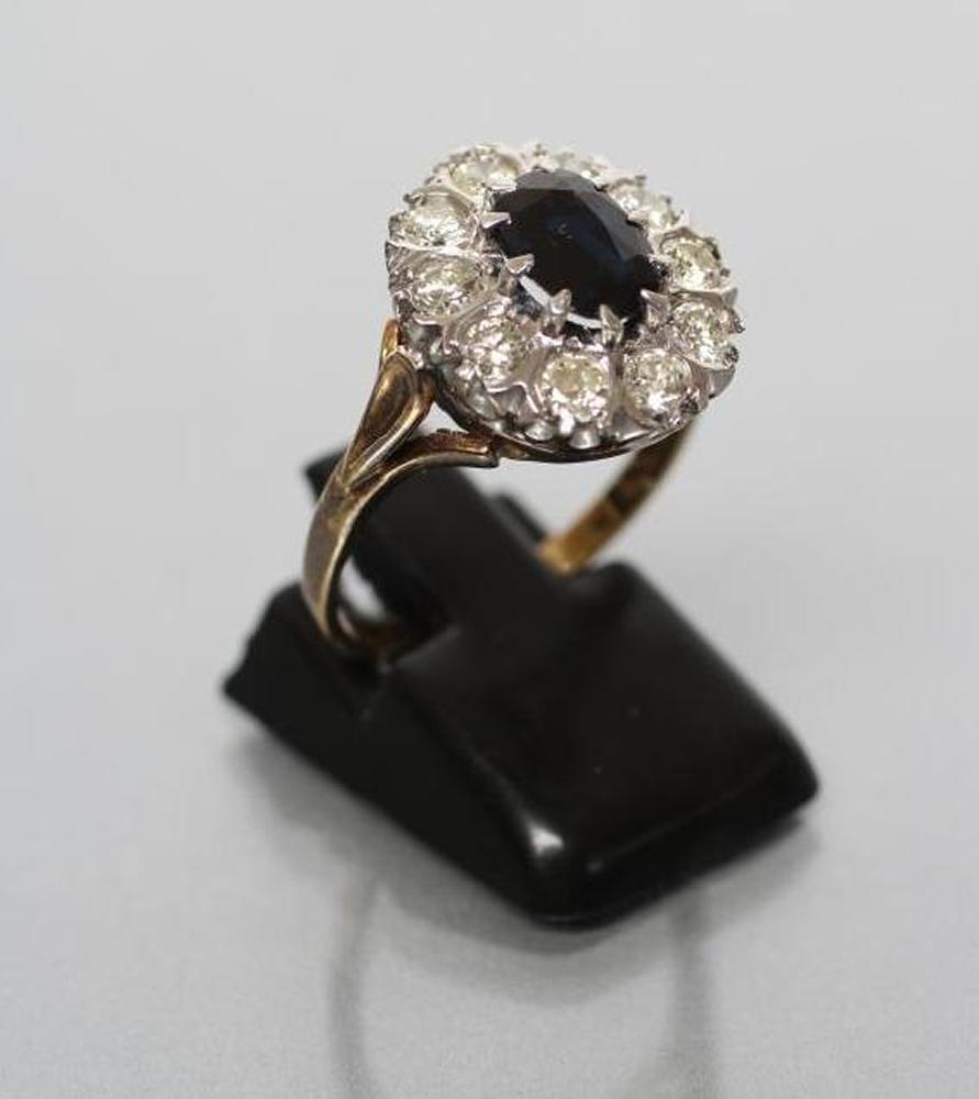 A SAPPHIRE AND DIAMOND CLUSTER RING Image