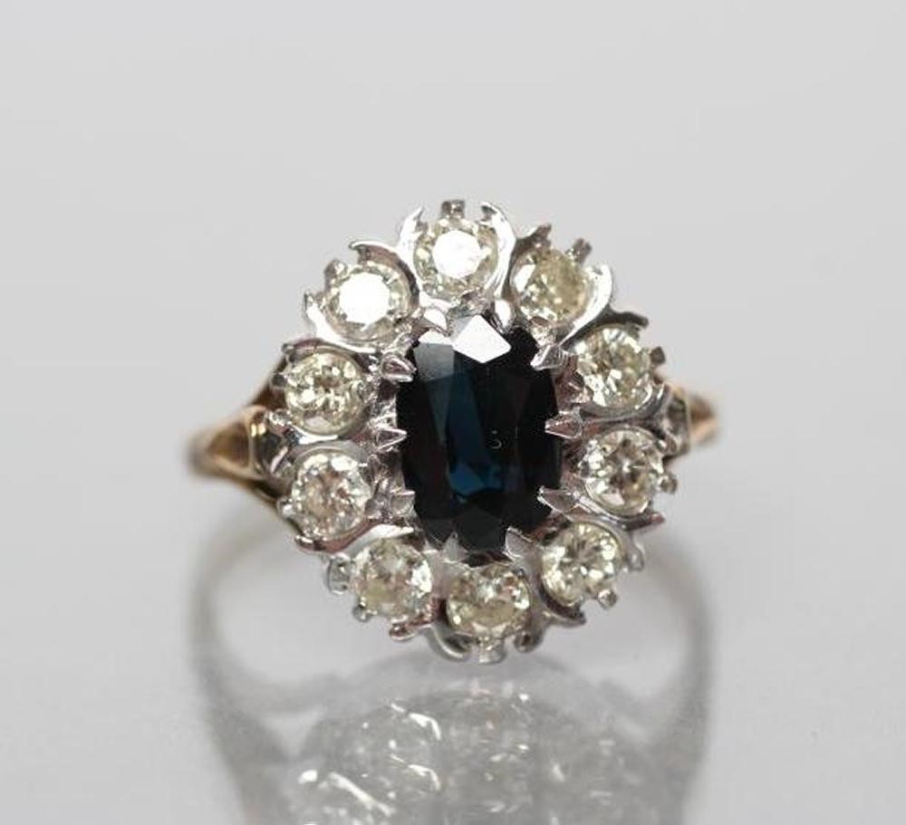 A SAPPHIRE AND DIAMOND CLUSTER RING Image