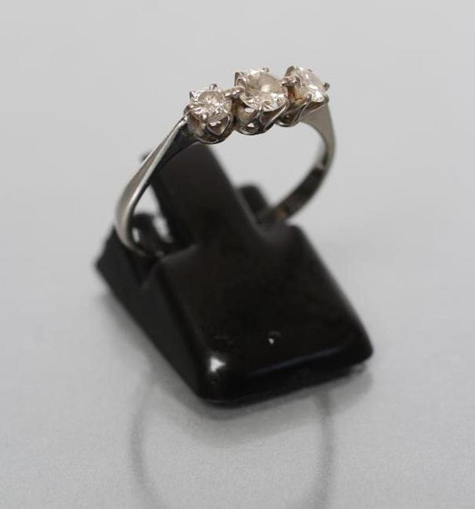 A THREE STONE DIAMOND RING Image