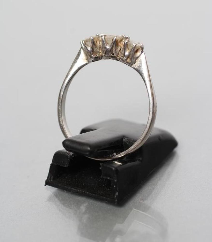 A THREE STONE DIAMOND RING Image