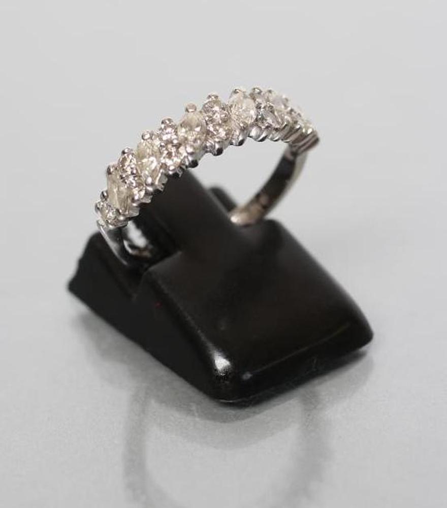 A DIAMOND HALF HOOP RING set with six marquise cut small stones with five pairs of small round Image
