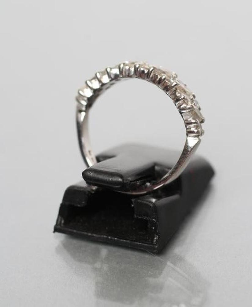 A DIAMOND HALF HOOP RING set with six marquise cut small stones with five pairs of small round Image
