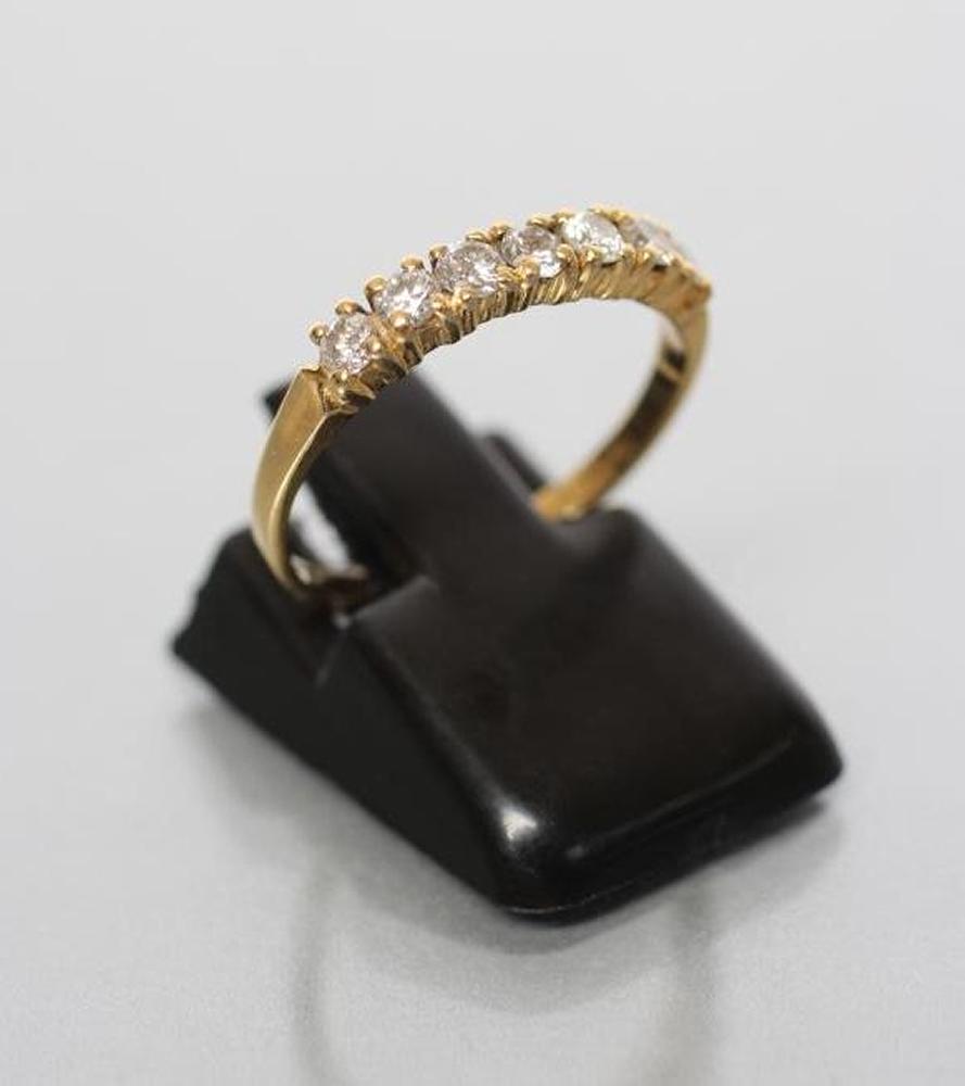 A SEVEN STONE DIAMOND HALF HOOP ETERNITY RING Image