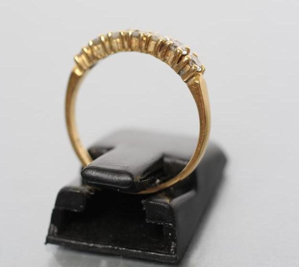 A SEVEN STONE DIAMOND HALF HOOP ETERNITY RING Image