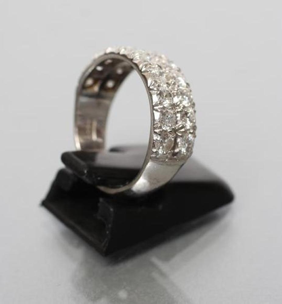 A DIAMOND HALF HOOP ETERNITY RING Image