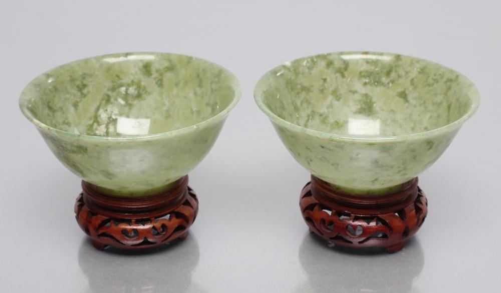 A PAIR OF TURNED AND POLISHED JADE BOWLS of plain circular form Image