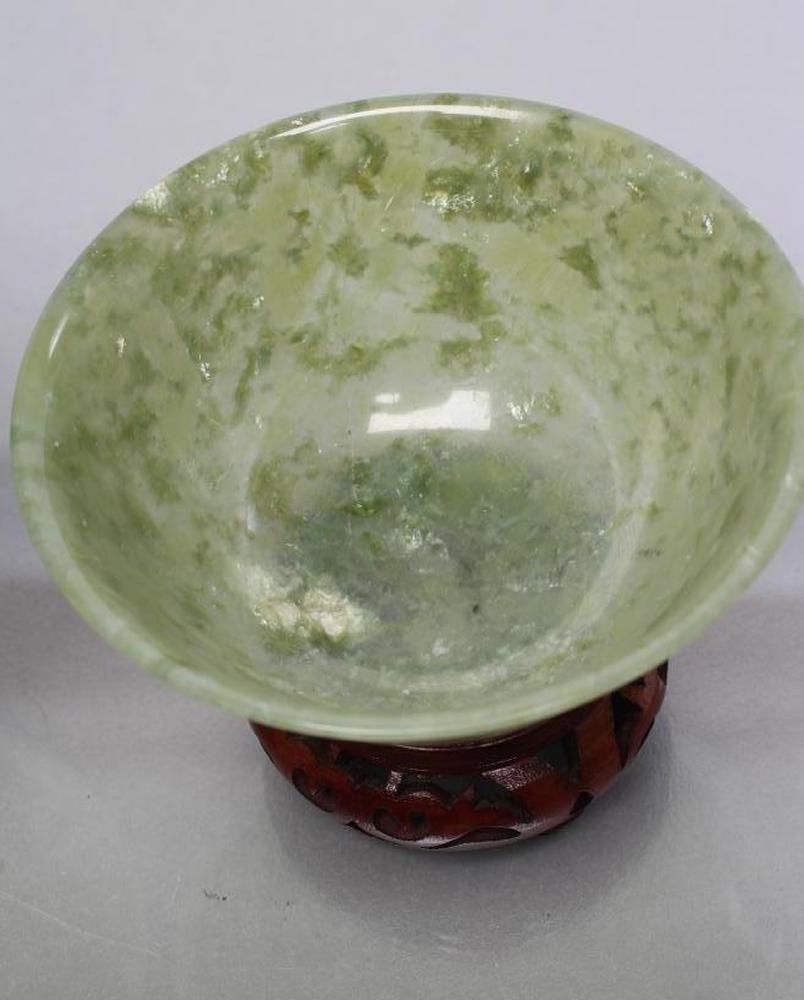 A PAIR OF TURNED AND POLISHED JADE BOWLS of plain circular form Image