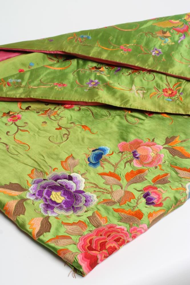 A CHINESE BRIGHT GREEN SILK LARGE OBLONG PANEL embroidered in brightly coloured silks and whipped Image