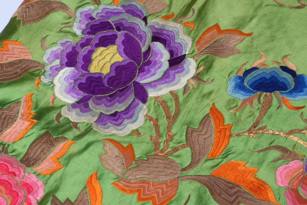 A CHINESE BRIGHT GREEN SILK LARGE OBLONG PANEL embroidered in brightly coloured silks and whipped Image