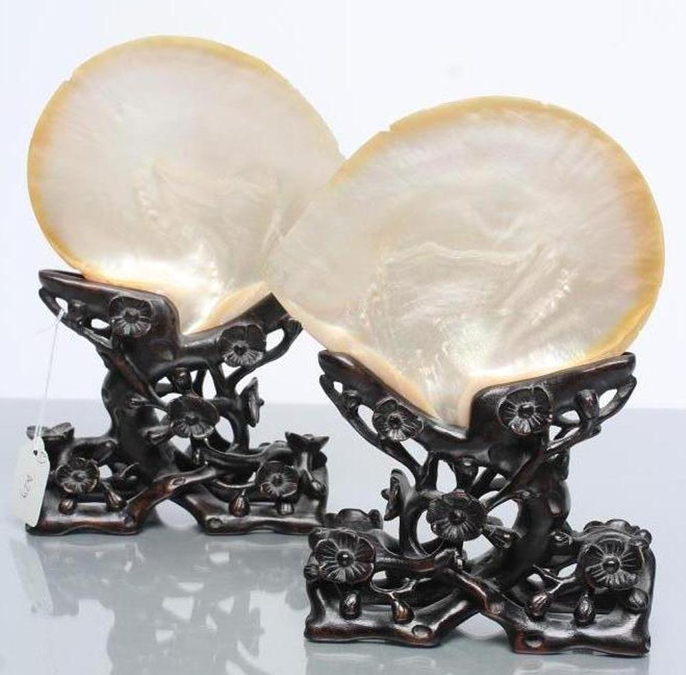A PAIR OF CHINESE HARDWOOD STANDS carved and pierced with flowering prunus Image