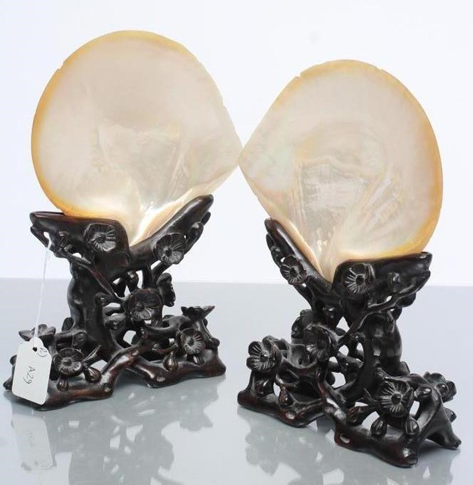 A PAIR OF CHINESE HARDWOOD STANDS carved and pierced with flowering prunus Image