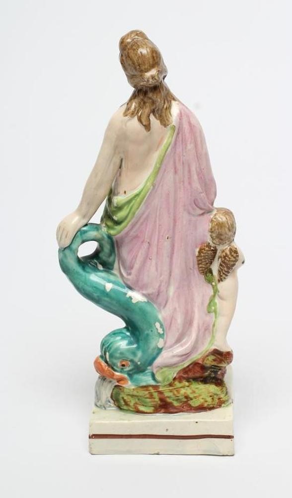 A POLYCHROME PEARLWARE FIGURE OF VENUS Image