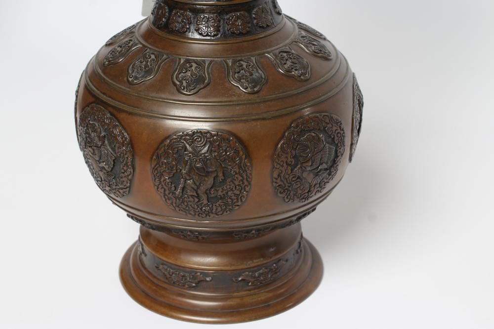 A JAPANESE BRONZE VASE of baluster form with cast and applied dragon handles and panels of Image