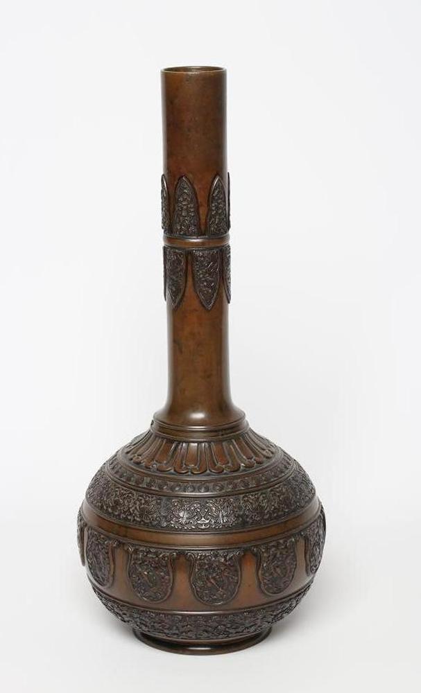 A JAPANESE BRONZE VASE of baluster form with lappet cast neck and girdled base with panels of flora Image