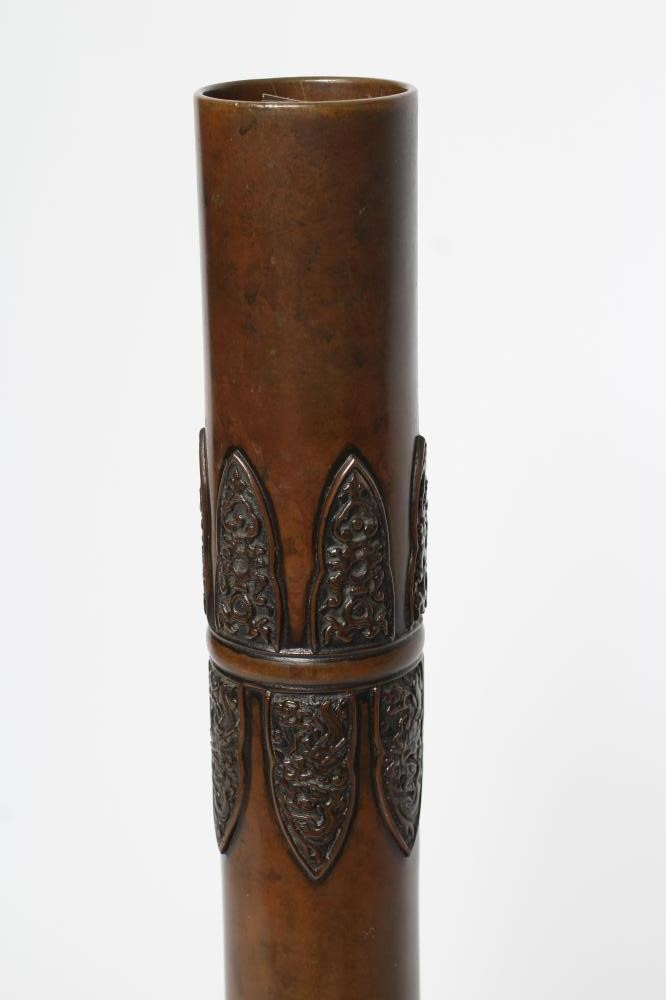 A JAPANESE BRONZE VASE of baluster form with lappet cast neck and girdled base with panels of flora Image
