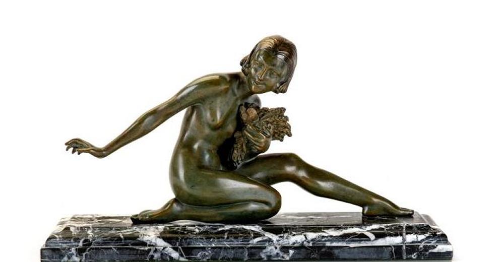 AFTER ARMAND GODARD - an Art Deco bronze figure modelled as a young female nude kneeling on her Image