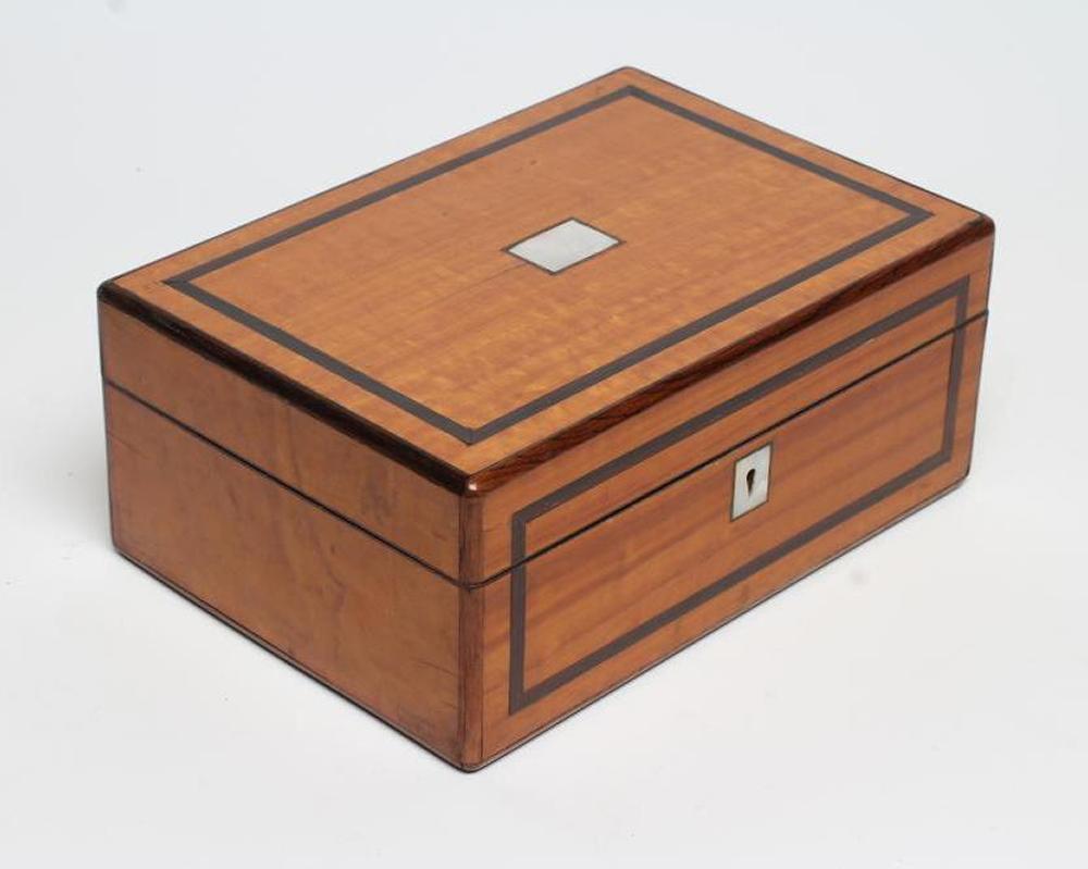 AN EARLY VICTORIAN SATINWOOD SEWING BOX of oblong form banded in rosewood Image
