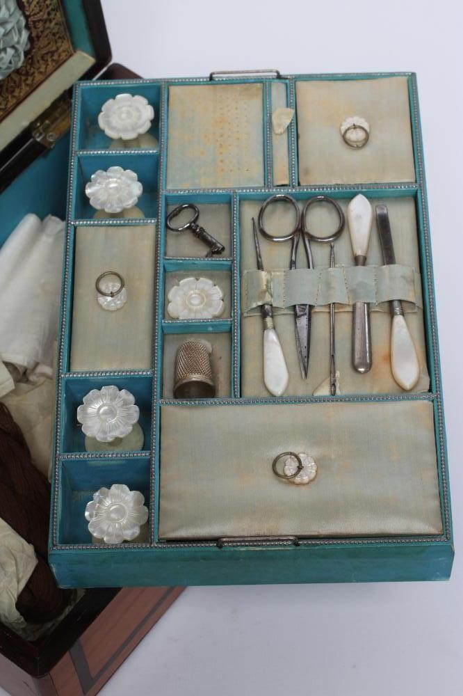 AN EARLY VICTORIAN SATINWOOD SEWING BOX of oblong form banded in rosewood Image