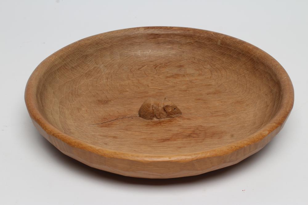 A ROBERT THOMPSON ADZED OAK FRUIT BOWL of shallow form centred by a carved mouse trademark in high Image