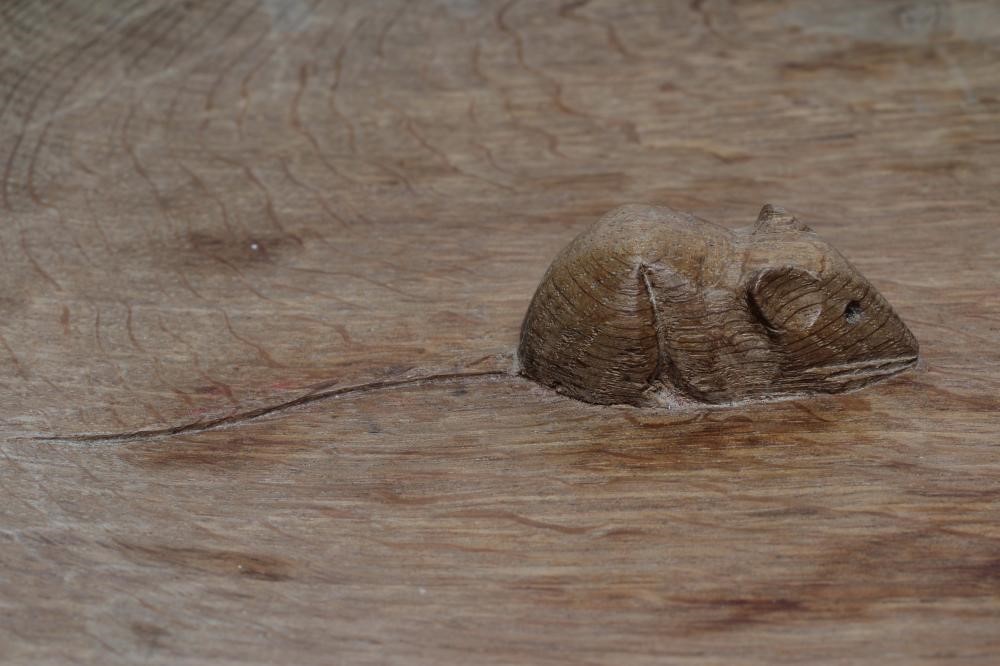 A ROBERT THOMPSON ADZED OAK FRUIT BOWL of shallow form centred by a carved mouse trademark in high Image