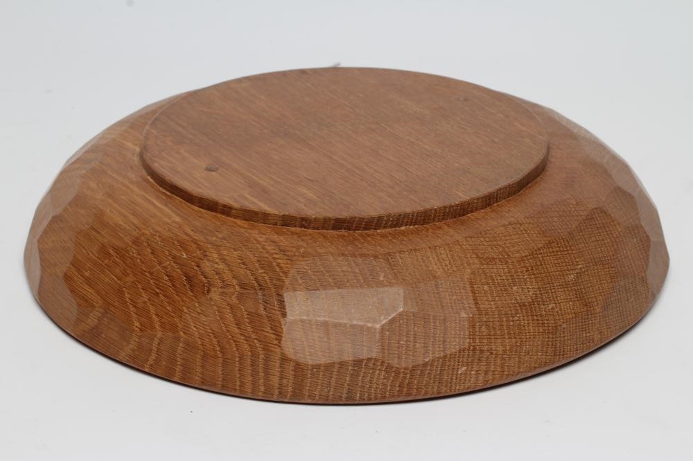 A ROBERT THOMPSON ADZED OAK FRUIT BOWL of shallow form centred by a carved mouse trademark in high Image