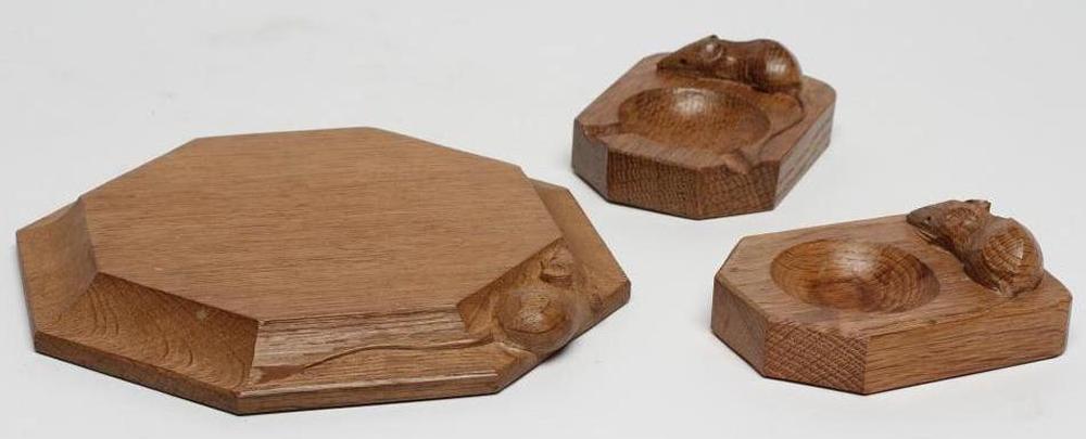 A ROBERT THOMPSON ADZED OAK SMALL CHOPPING BOARD/STAND of octagonal form Image