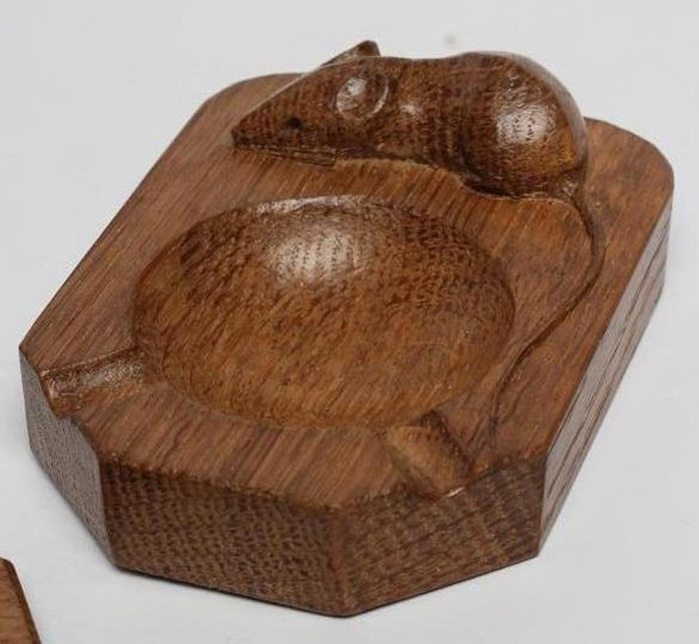 A ROBERT THOMPSON ADZED OAK SMALL CHOPPING BOARD/STAND of octagonal form Image